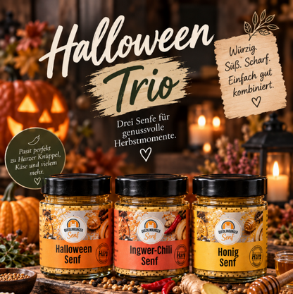 Halloween-Trio mit Kerzen und Kürbis